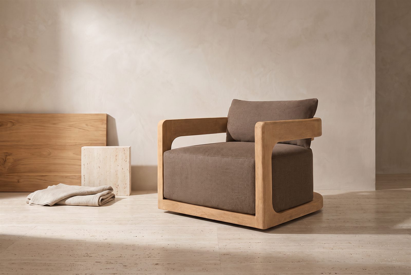A made-to-order armchair with teak, stone and linen samples